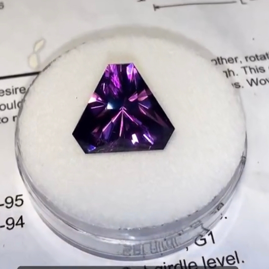 A purple faceted stone.